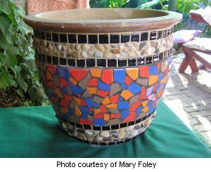 Mary's Mosaic flower pot grouted in cream and black grout.